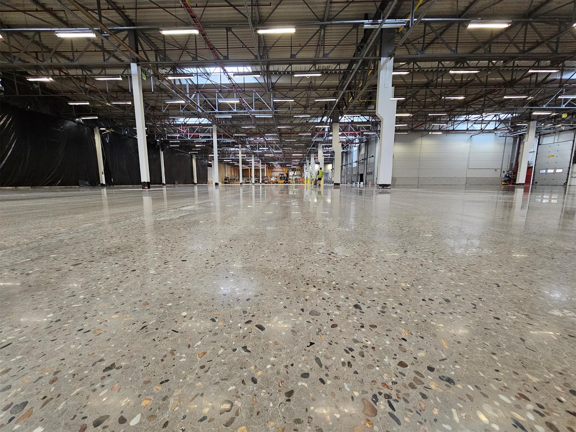 Caterpillar Grimbergen - Stofvrije renovatie van bedrijfsvloer - Art & Reno